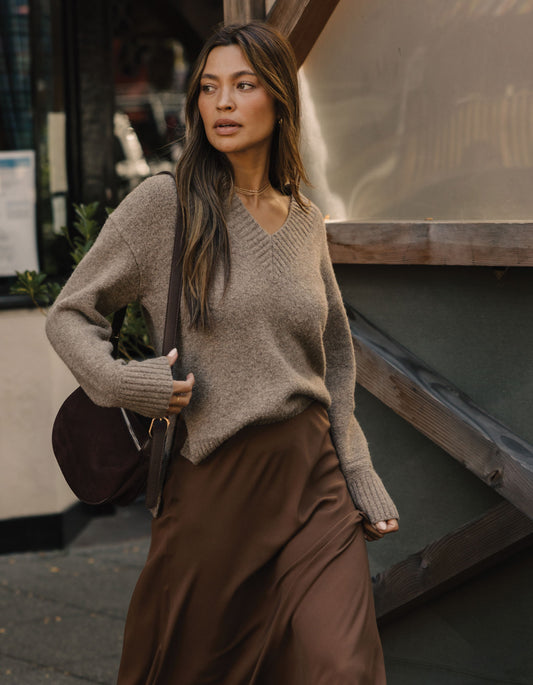 Homebound V-Neck Sweater in Toasted Chestnut — outdoor view on model