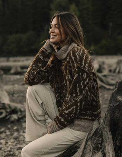 Freya Sweater in Hickory Multi — seated outdoor view on model