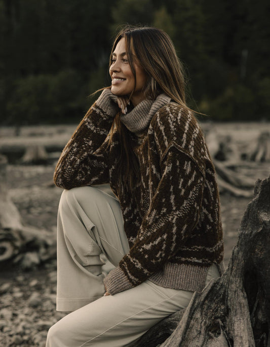 Freya Sweater in Hickory Multi — seated outdoor view on model