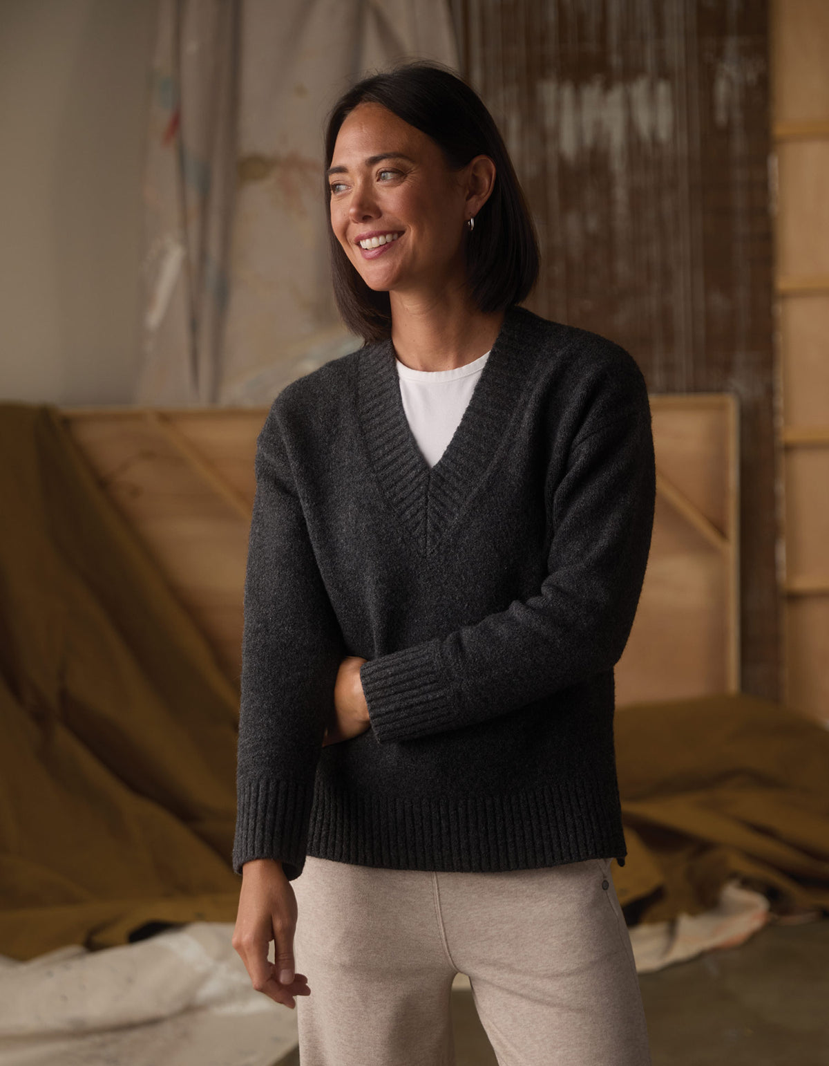 Homebound V-Neck Sweater in Charcoal — front view smiling