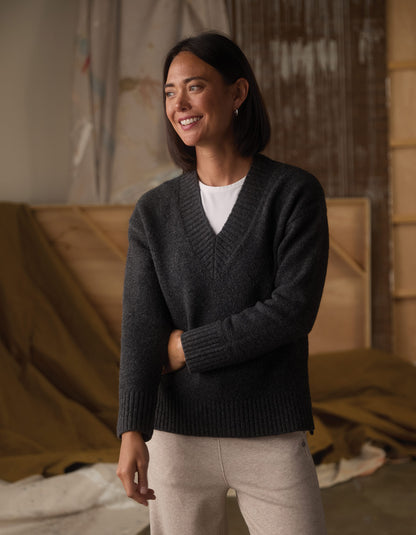 Homebound V-Neck Sweater in Charcoal — front view smiling