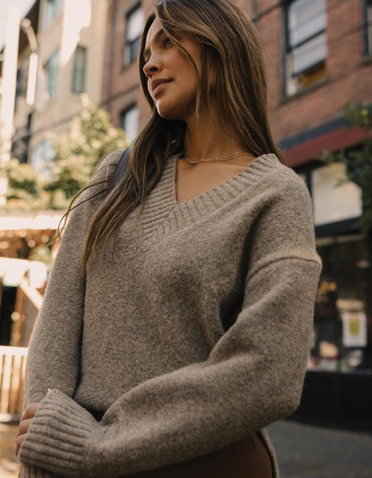 Homebound V-Neck Sweater in Toasted Chestnut — outdoor close-up on model