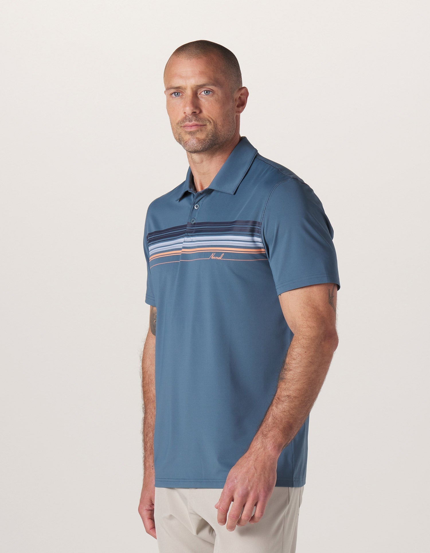 Normal Script Performance Polo in Mineral Blue On Model from Side