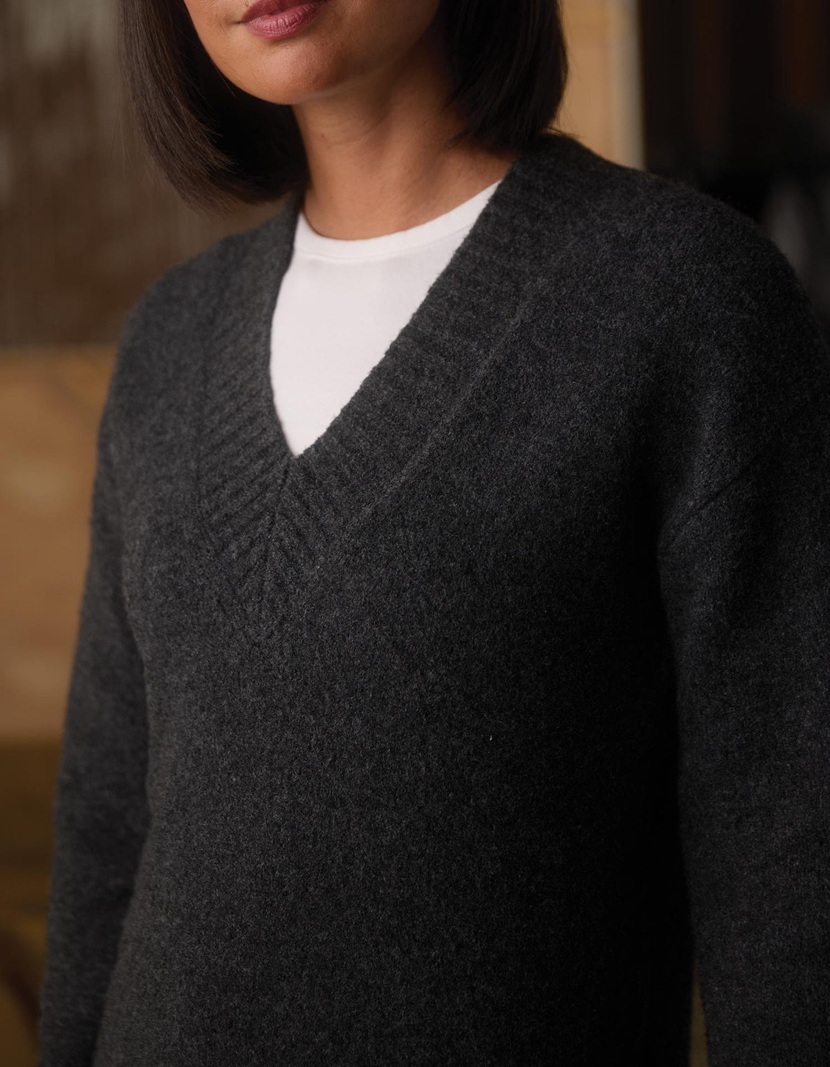 Homebound V-Neck Sweater in Charcoal — v-neck detail
