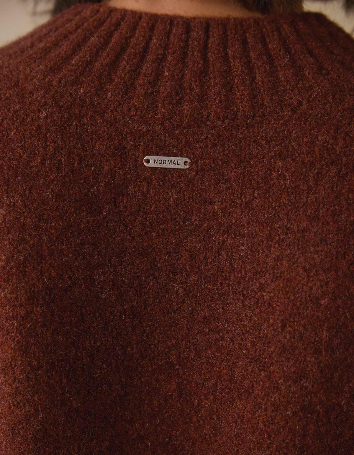 Homebound V-Neck Sweater in Spiced Brandy — knit and tag detail