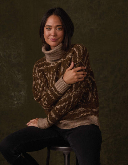 Freya Sweater in Hickory Multi — seated studio view on model