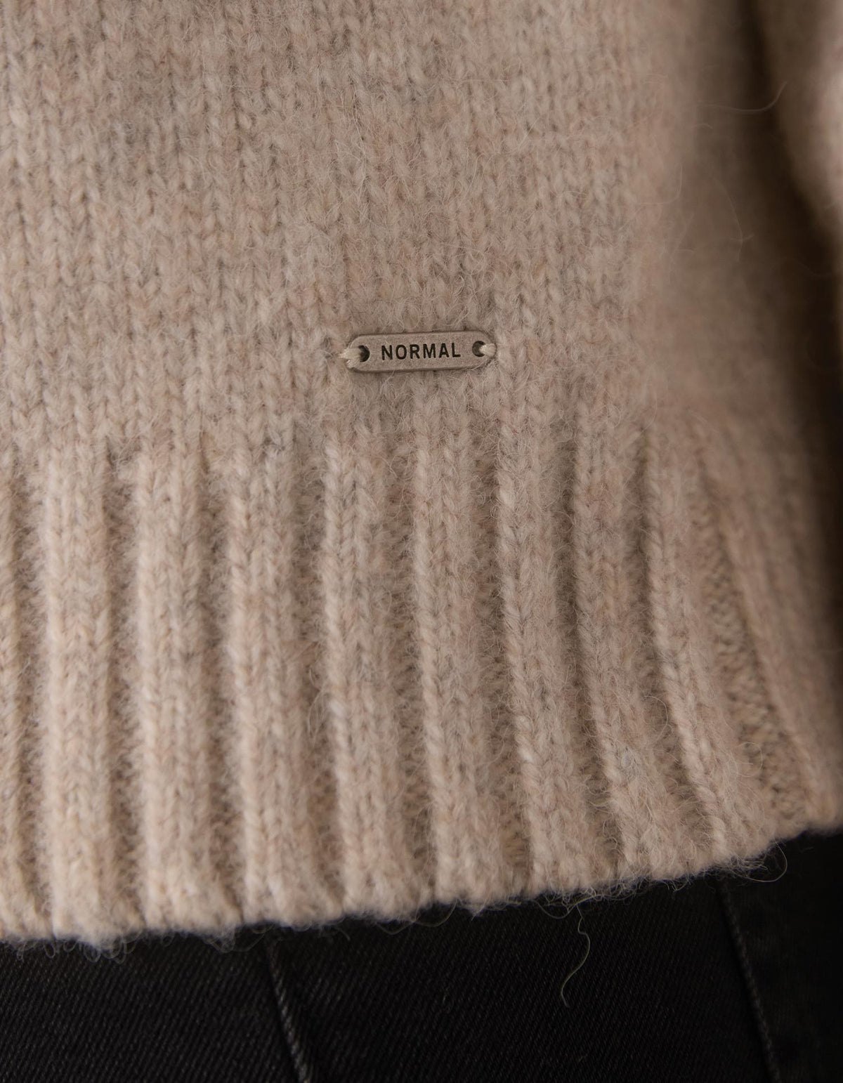Astrid Fair Isle Sweater in Port Wine Multi — hem and tag detail