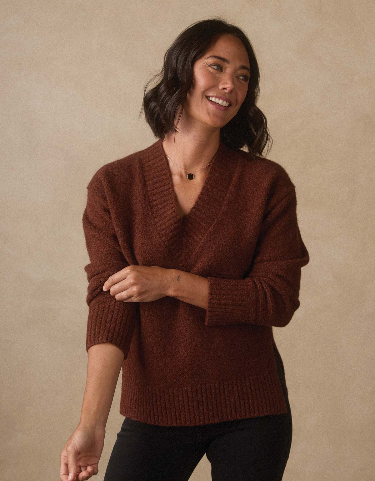Homebound V-Neck Sweater in Spiced Brandy — three-quarter view on model
