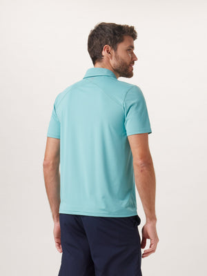Cross-Back Seamed Performance Polo in Turquoise On Model from Back