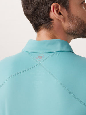 Cross-Back Seamed Performance Polo in Turquoise On Model Back Detail