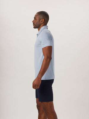 Fore Stripe Performance Polo in Blue Fog On Model from Side