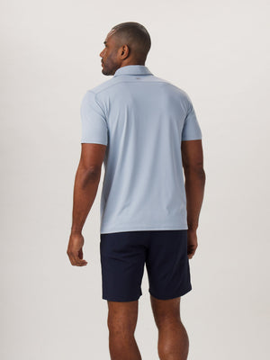 Fore Stripe Performance Polo in Blue Fog On Model from Back