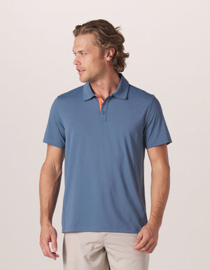 Cross-Back Seamed Performance Polo in Mineral Blue On Model from Front