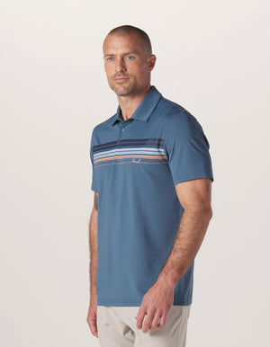 Normal Script Performance Polo in Mineral Blue On Model from Side