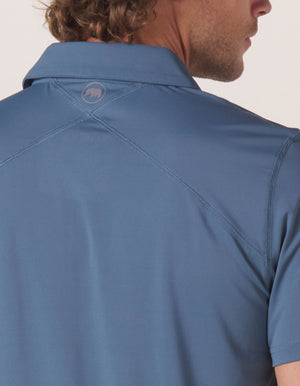 Cross-Back Seamed Performance Polo in Mineral Blue On Model Back Detail
