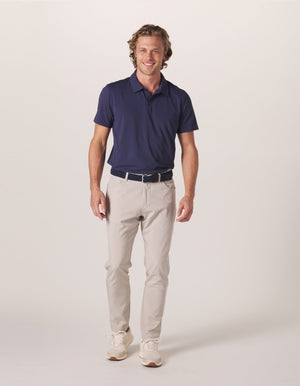 Cross-Back Seamed Performance Polo in Navy On Model from Front