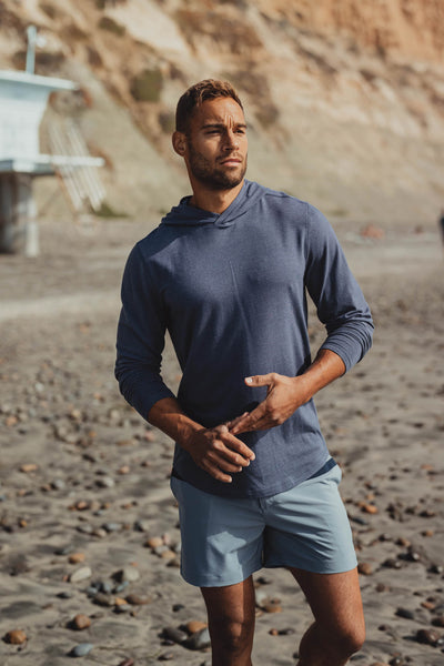 Active Puremeso Hoodie in Navy On Model at beach